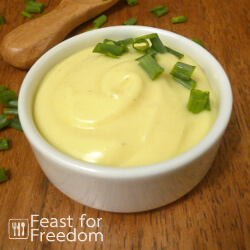 Fresh mayonnaise in a small glass bowl